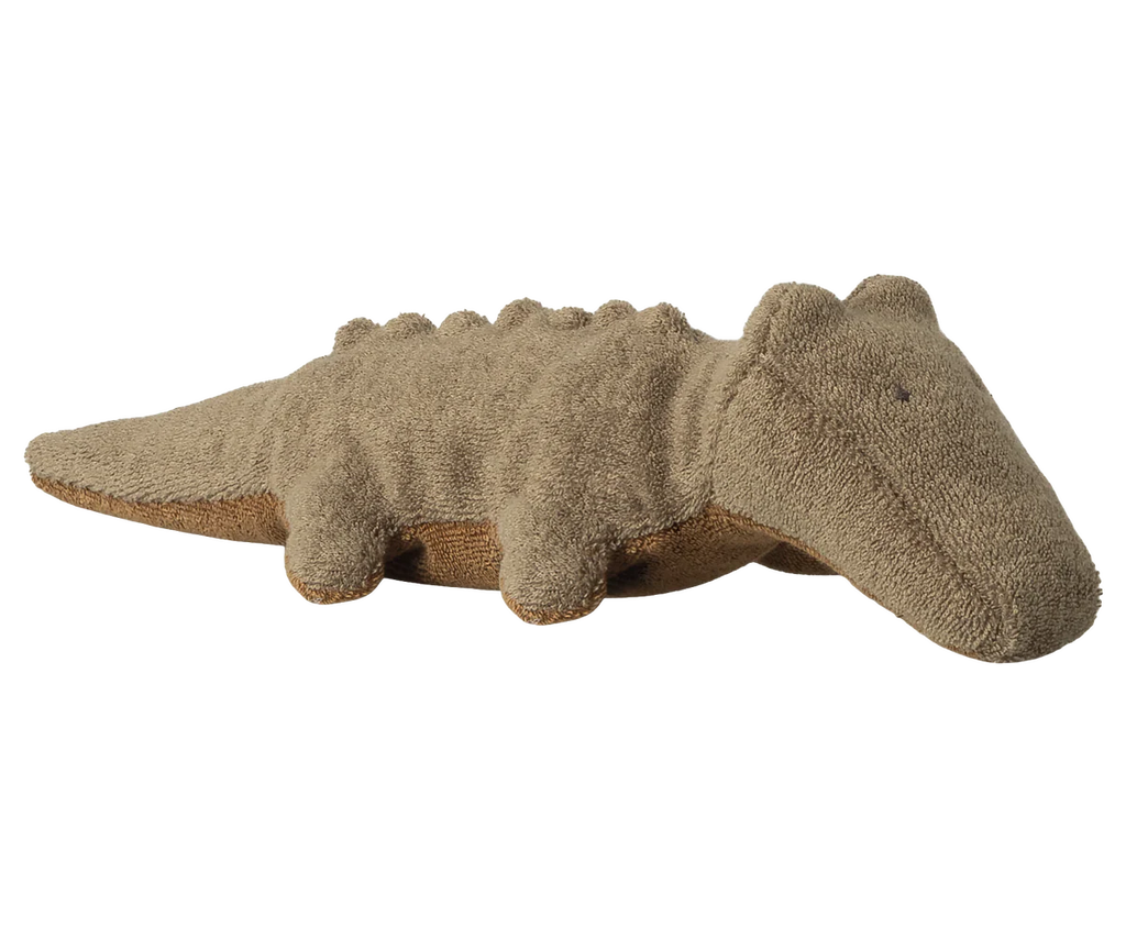 The Maileg Crocodile, Mini - Olive Green is a soft, huggable plush with small legs, a long snout, embroidered eyes, and a textured back—perfect for cuddling.