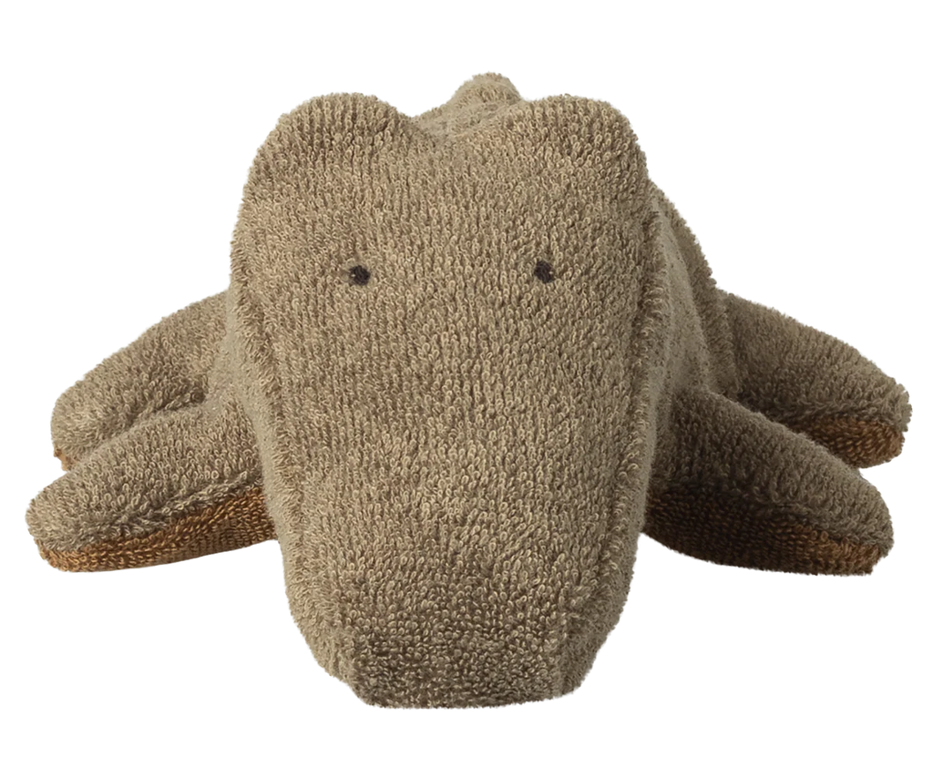 The Maileg Crocodile, Mini - Olive Green is a soft, huggable plush toy with a simple face and dot-like eyes. This adorable stuffed animal lies flat with outstretched legs—ideal for soft toy lovers. Expected arrival: 06/15/26.