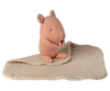 The Maileg Lullaby Friends, Pig, Mini - Rose is a soft toy shaped like a pink pig, resting on a cream-colored dotted cuddle cloth with stitched details—an adorable newborn gift.