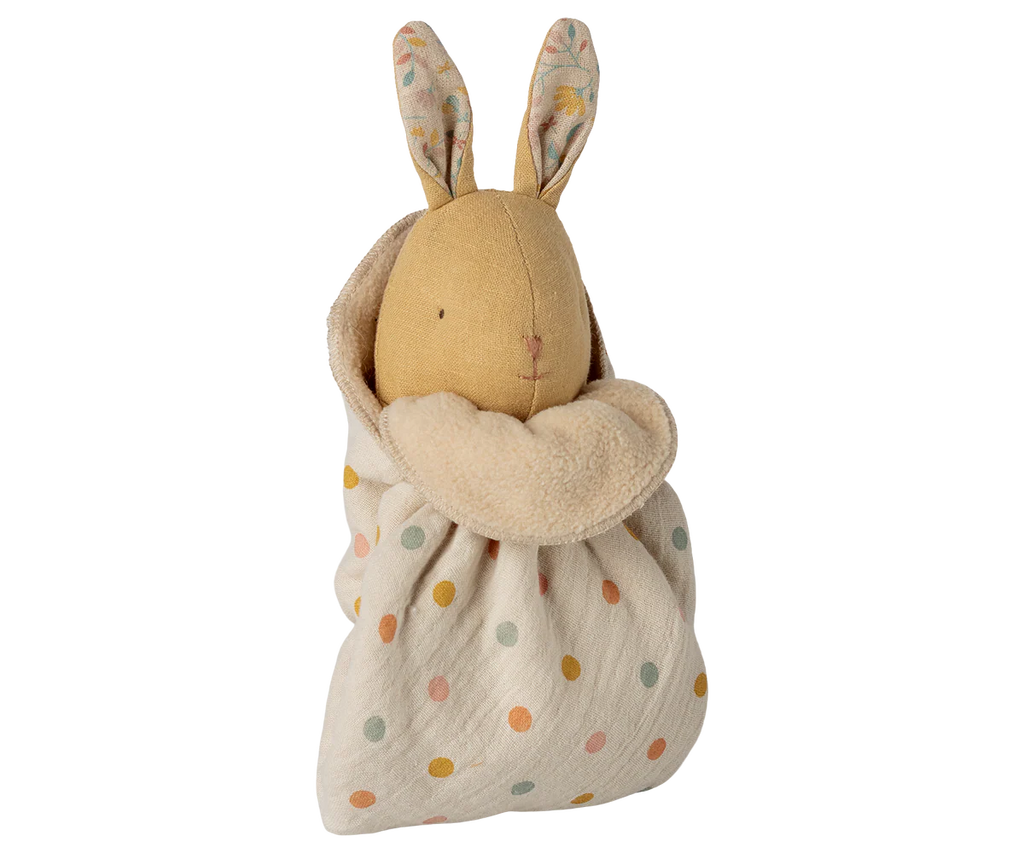 Maileg Lullaby Friends, Bunny, Mini - Cream Yellow is a soft toy with stitched features and long ears, wrapped in a cream-yellow polka dot blanket—an adorable newborn gift.