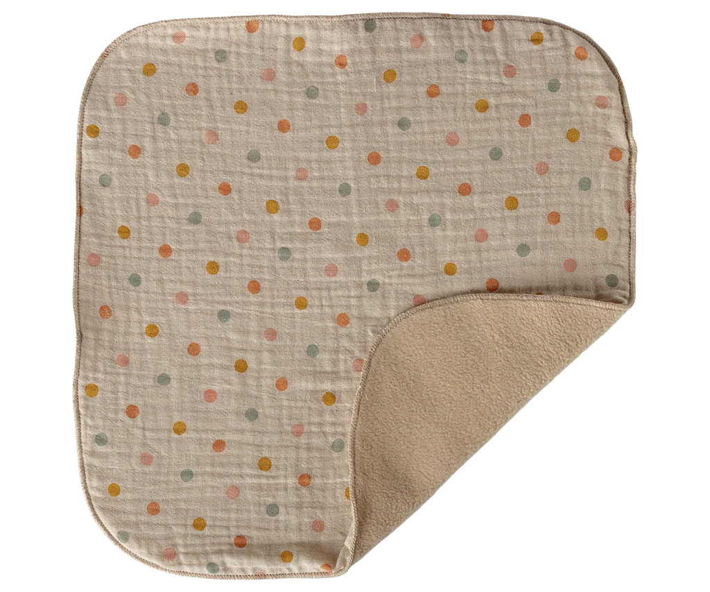 The Maileg Lullaby Friends Bunny Mini in Cream Yellow (arriving 04/15/26) is a square, beige baby blanket with rounded corners and pastel polka dots, plus a soft tan lining—ideal as a gift or paired with lullaby friends.