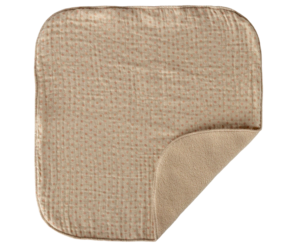 This beige baby blanket with rounded corners and dotted pattern pairs perfectly with Maileg Lullaby Friends, Bunny, Mini - Nature (arriving 04/15/26), for a cozy newborn gift or extra comfort.