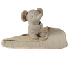 The Maileg Lullaby Friends, Elephant, Mini - Iron Grey sits on a folded beige textured baby blanket with patterned ears, creating a charming newborn gift.