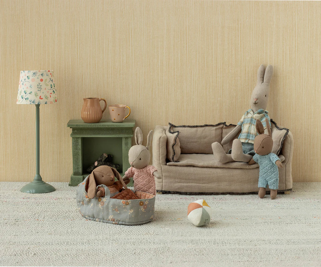 Create a charming scene with the Maileg Micro Bunny With Ball - Brown - Blue (With Magnetic Hands), featuring cuddly bunnies, a colorful ball, and cozy accessories for delightful storytelling and imaginative play.