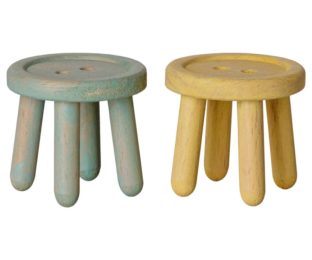 The PRE-ORDER: Maileg Stool Set, Mouse - Mint/Light Yellow (Estimated Arrival Mid July) includes two small wooden stools with vintage finishes in mint and light yellow, each featuring three sturdy legs and smooth, rounded edges for rustic charm.