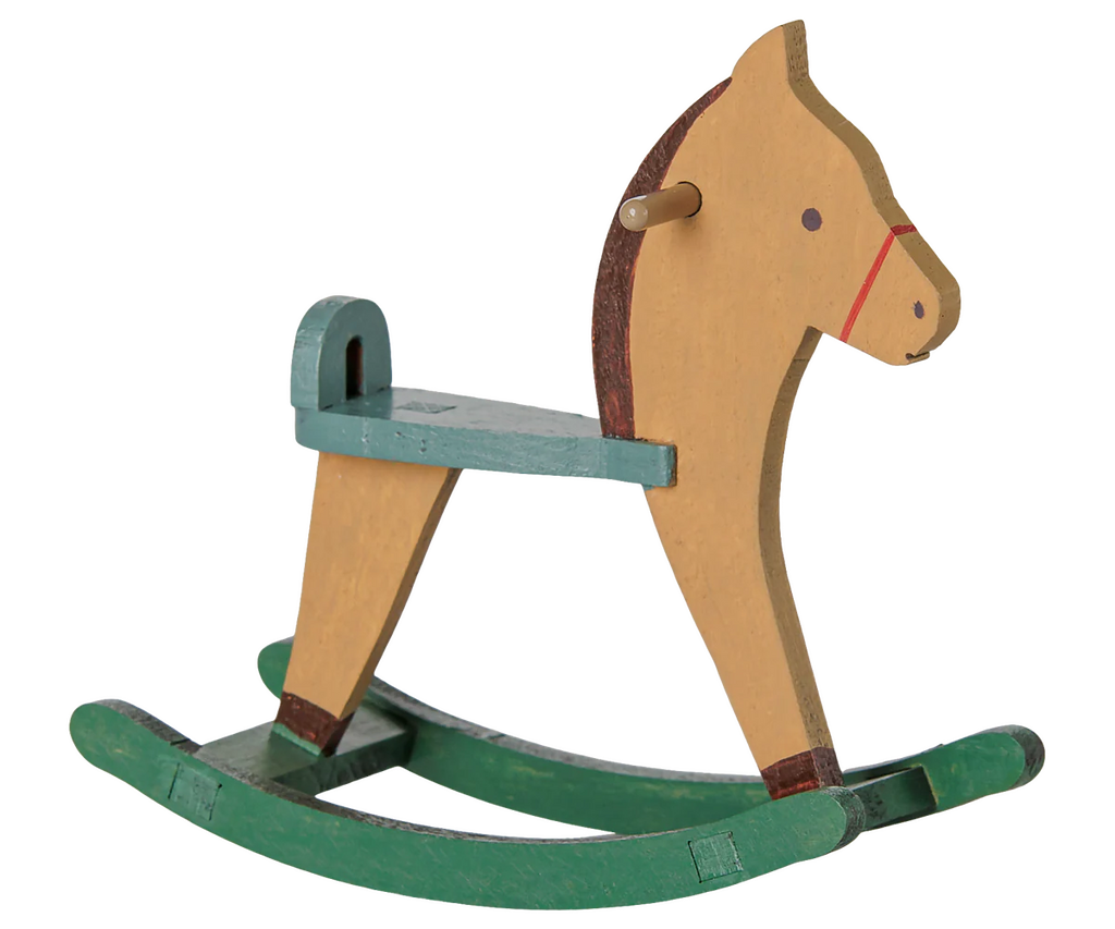 PRE-ORDER: Maileg Rocking Horse, Mouse - Light Brown. This charming wooden rocking horse features a tan body, green seat and curved green rockers with painted details and a handle stick. Estimated arrival early September.