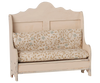 The PRE-ORDER Maileg Kitchen Bench, Mouse - Light Sand (arriving mid September), is a cosy, vintage-style wooden bench featuring a high back, armrests, and a comfy leaf-patterned cushioned seat—perfect for any nook.