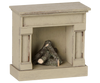 The PRE-ORDER: Maileg Fireplace, Mouse - Off White (Estimated Arrival Mid August) is a small off-white wooden fireplace with a vintage finish, simple mantel, and mini logs—ideal for adding charm to any miniature home.