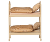 The PRE-ORDER: Maileg Bunk Bed, Mouse - Wheat (Estimated Arrival Mid August) is a small beige bunk bed with floral-patterned bedding—perfect for cozy sleepovers in your Mouse hole Farmhouse, shown against a plain white background.