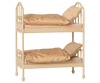 The PRE-ORDER: Maileg Bunk Bed, Mouse - Wheat features two levels with patterned bedding and pillows. With vertical rails, rounded ends, and subtle floral/plaid details, it's the perfect sleepover toy. Estimated arrival mid August.