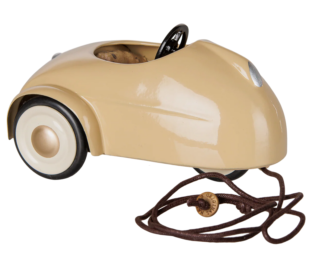 PRE-ORDER: Maileg Car, Mouse – Wheat. A vintage beige pull along toy car with white wheels, black steering wheel, and brown pull string attached to the front. Estimated arrival mid August. Set against a white background.