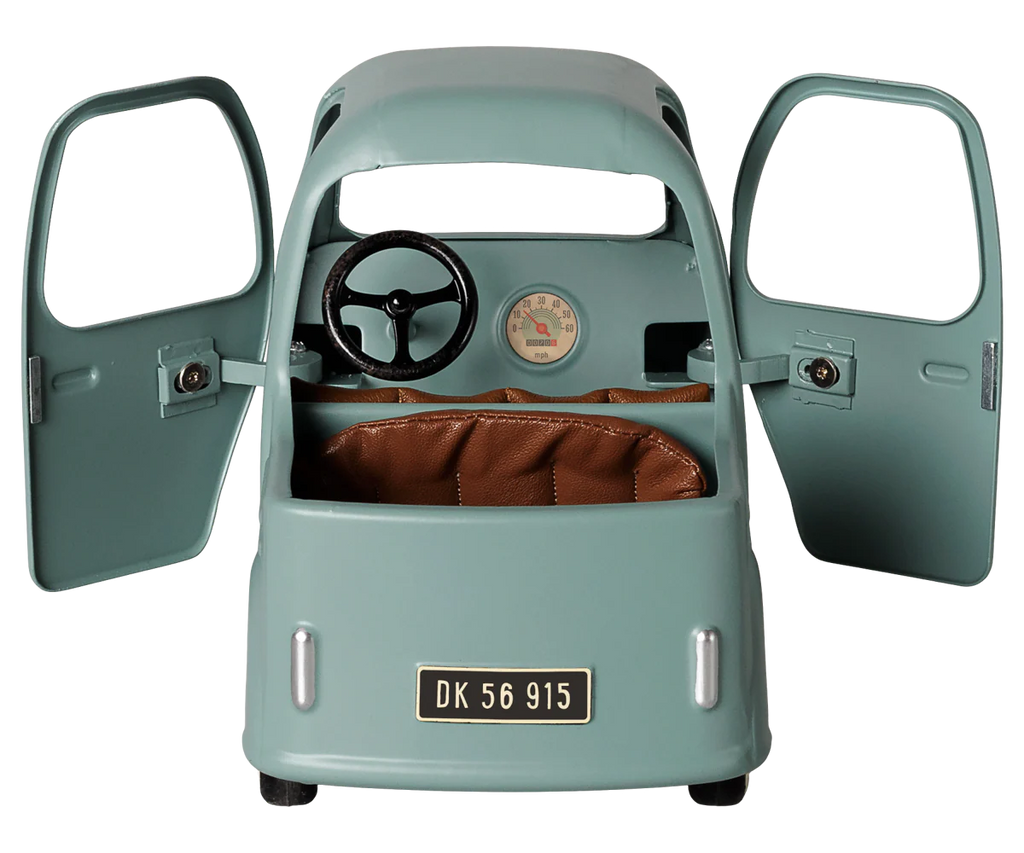 The PRE-ORDER: Maileg Truck, Mouse (arriving early November) is a small, vintage-style vehicle with blue-green paint, brown seats, opening front doors, a steering wheel, visible speedometer, and "DK 56 915" license plate. Perfect for play scenes.