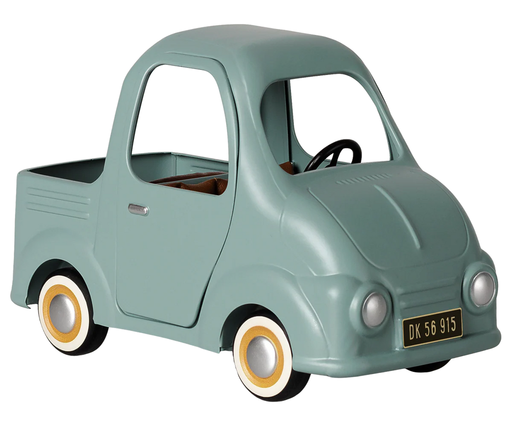 PRE-ORDER: Maileg Truck, Mouse—this small, vintage-style toy car comes in light teal with a black steering wheel, tan interior, white-rimmed wheels, and "DK 56 915" license plate. Perfect for play or the ideal mouse family car. Estimated arrival early November.