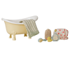 The PRE-ORDER Maileg Bathtub Set, Mouse - Yellow (arriving mid October), includes a toy bathtub, green towel, brush, yellow rubber duck, bath sponge, bottle, and pink polka dot shower cap—perfect for imaginative pretend play.