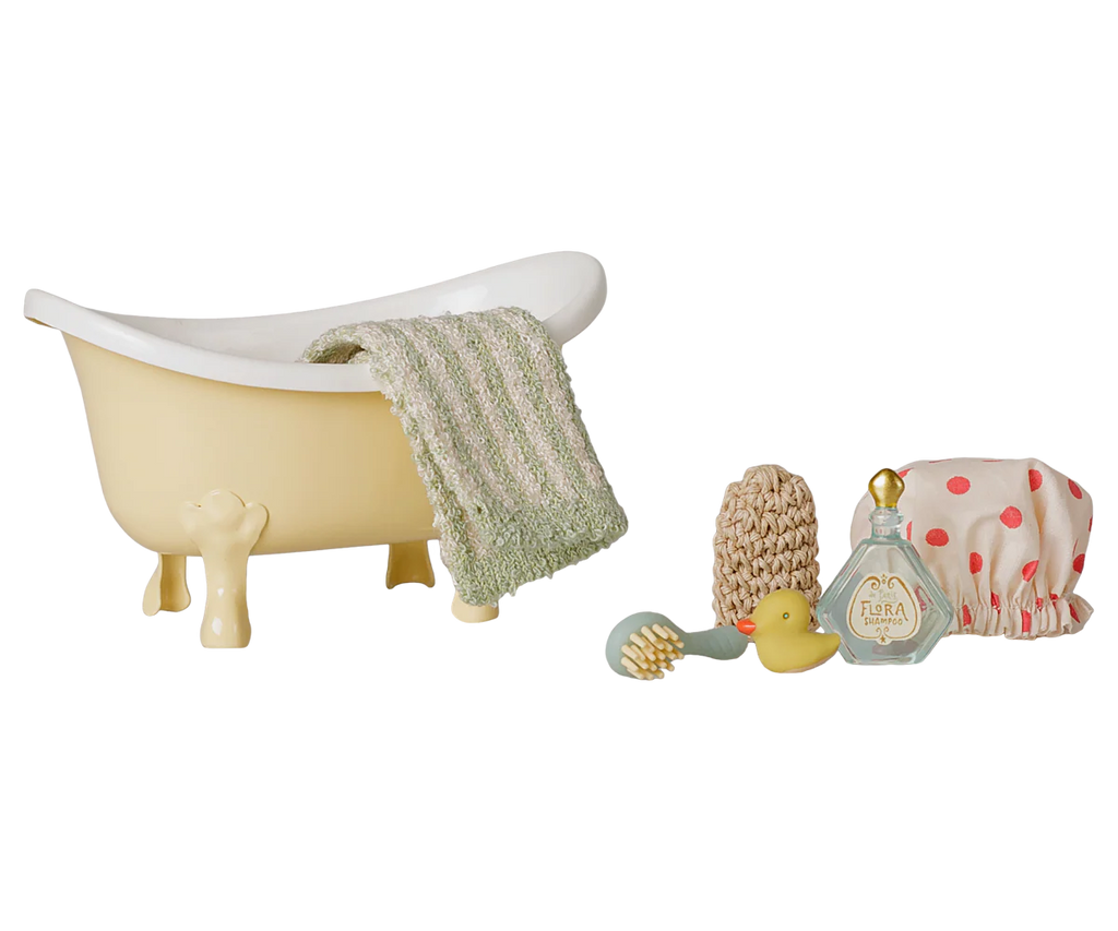 The PRE-ORDER Maileg Bathtub Set, Mouse - Yellow (arriving mid October), includes a toy bathtub, green towel, brush, yellow rubber duck, bath sponge, bottle, and pink polka dot shower cap—perfect for imaginative pretend play.