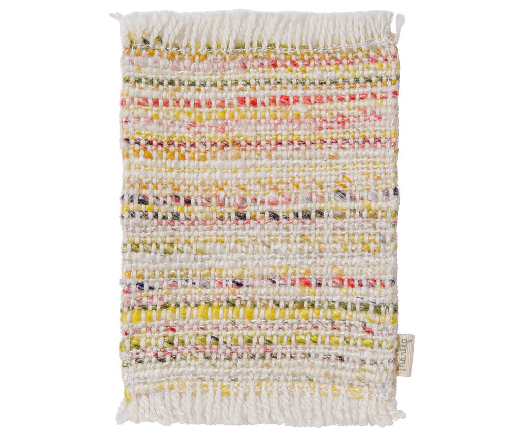 A rectangular woven PRE-ORDER: Maileg Rug, Mouse, Mini - Multi stripe swatch features white fringed edges and horizontal yellow, pink, orange, and white stripes. Includes a right fabric tag—ideal as a stylish living room sample. Estimated arrival mid September.