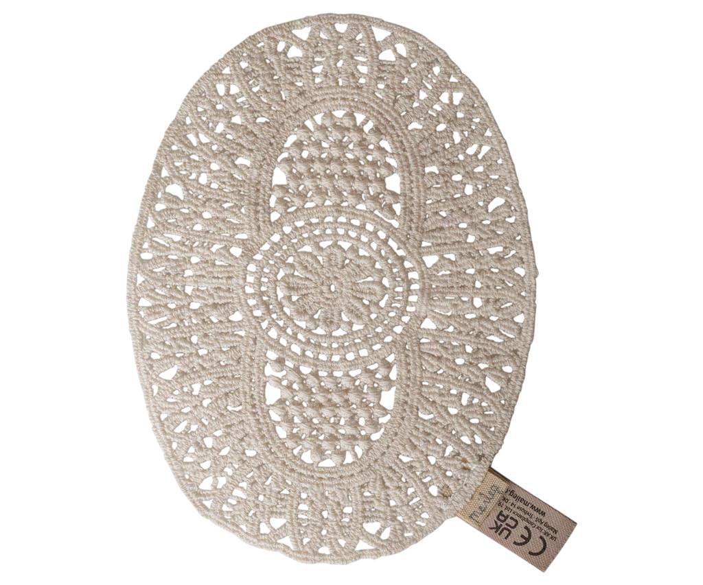PRE-ORDER: Maileg Lace Rug, Mouse—an oval beige crochet doily with intricate symmetrical patterns and a small fabric tag, ideal as a lace rug or dollhouse decor. Estimated arrival: mid September.