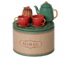 The PRE-ORDER: Maileg Christmas Tea Party, Mouse - Red/Green set features a green teapot, two red teacups with saucers, and a cake on a round "Maileg" box—perfect for holiday tea parties. Estimated arrival early November.