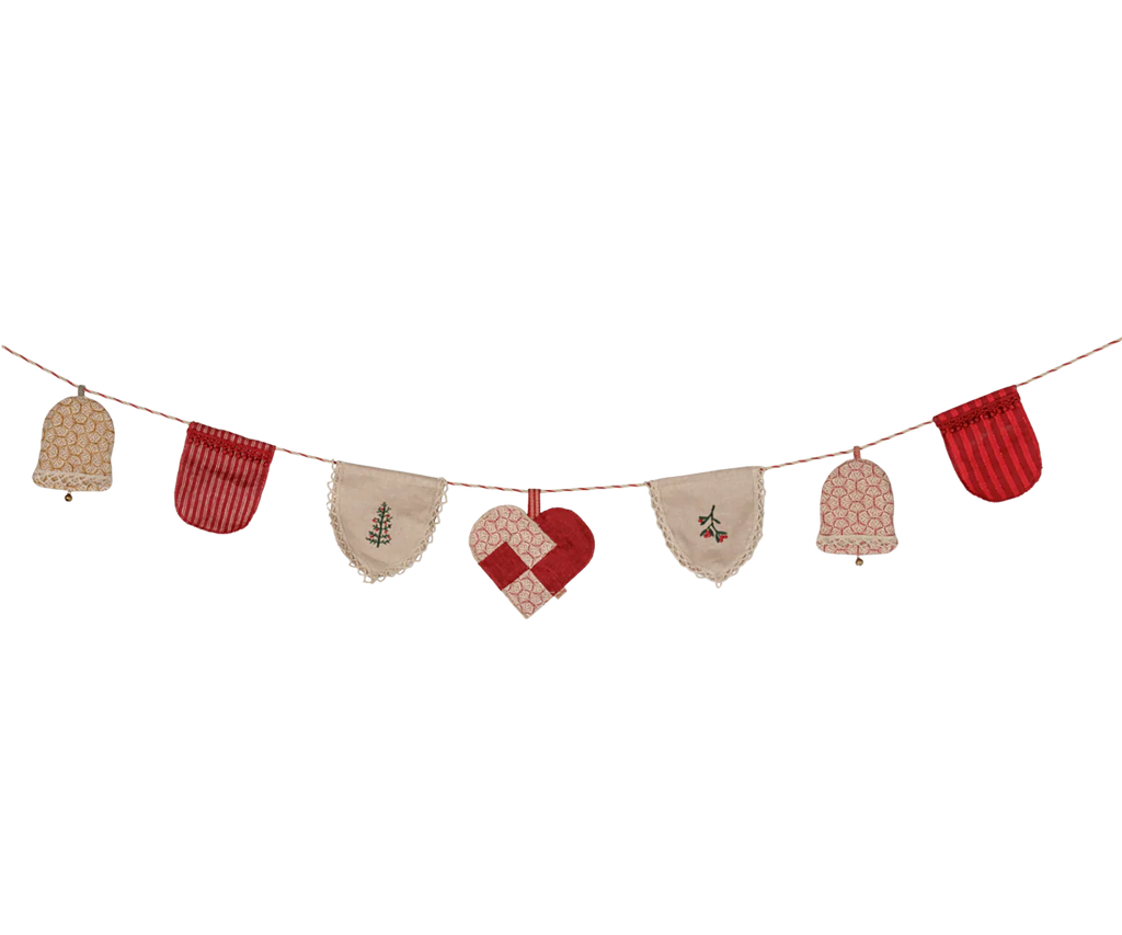 The PRE-ORDER: Maileg Christmas Garland (estimated arrival mid October) features red and beige fabric ornaments—bells, a heart, and patterned flags—on a string, making it the perfect festive touch for cozy holiday decor.