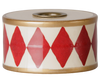 The PRE-ORDER: Maileg Christmas Candle Holder, Drum - Red/Off White (Estimated Arrival Mid October) features a charming cylindrical spool with red diamonds on white, gold borders, and a central top hole—a nostalgic Christmas decoration.