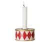 The PRE-ORDER: Maileg Christmas Candle Holder, Drum - Red/Off White features a white candle in a round holder decorated with red diamonds and gold trim—a festive accent for your Christmas decor. Estimated arrival mid October.