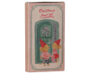 A box labeled "PRE-ORDER: Maileg Christmas Door Set, Mouse" shows two mice in red hats and striped outfits standing by a green door with a festive wreath. Estimated arrival is early November.