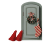 The PRE-ORDER: Maileg Christmas Door Set, Mouse (Estimated Arrival Early November) features a small arched gray door with a wreath, candy canes, striped stocking, and two red felt gnome hats—perfect for your festive Christmas decor.