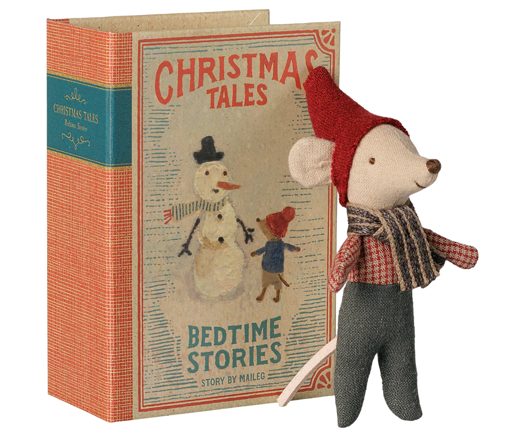 The PRE-ORDER: Maileg Christmas Mouse, Baby in Book (Estimated Arrival Early September) features a festive baby mouse in a red hat and scarf beside an illustrated "Christmas Tales: Bedtime Stories" book with a snowman and child on the cover.