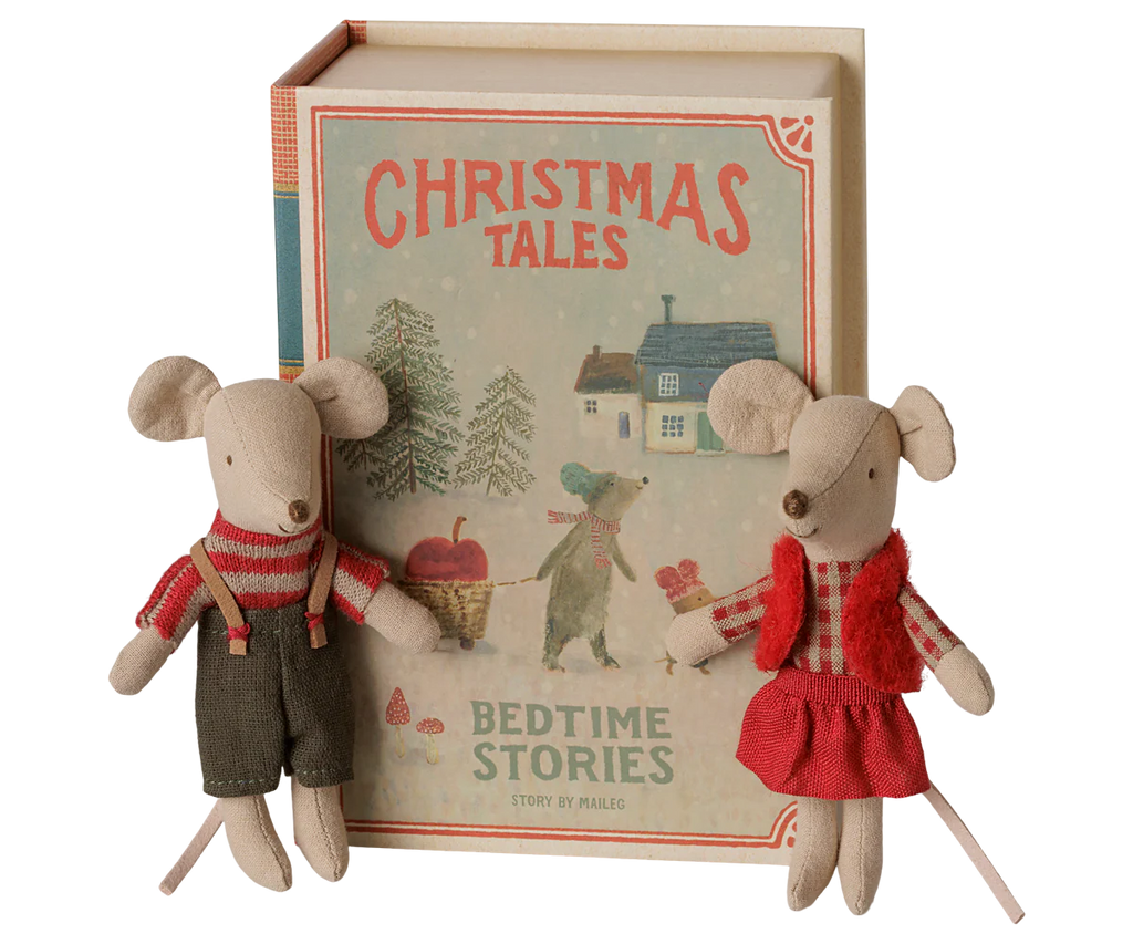 The PRE-ORDER: Maileg Christmas Twin Mice, Little Sister and Brother in Book (arriving early September), feature one mouse in dark overalls and the other in a red skirt and vest, sitting on bedding before a festive "Christmas Tales Bedtime Stories" book.