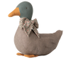 The PRE-ORDER: Maileg Duck with Bow - Grey features a plush fabric, orange beak and feet, and a floral bow. Its handcrafted look makes it a charming seasonal decor piece, perfect for adding an authentic Christmas touch. Estimated arrival mid September.