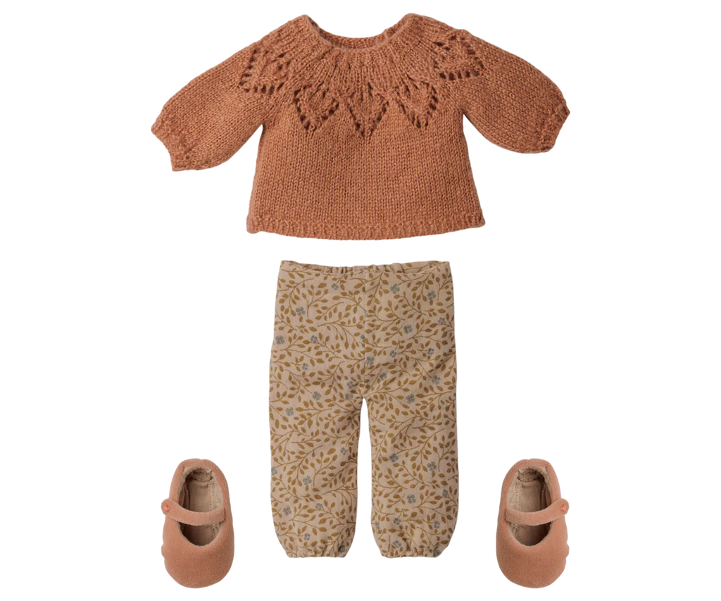 A cozy flat lay features a rust leaf-patterned sweater, beige pants with brown leafy print, matching rust shoes, and the PRE-ORDER: Maileg Bunny, Size 3 – Classic – Pants and Knitted Sweater (arriving early November).