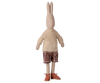 The PRE-ORDER: Maileg Rabbit, Size 4 - Classic, features pants and a knitted sweater. This charming stuffed toy stands upright against a white background, highlighting its stylish natural fabrics. Estimated arrival: Early November.
