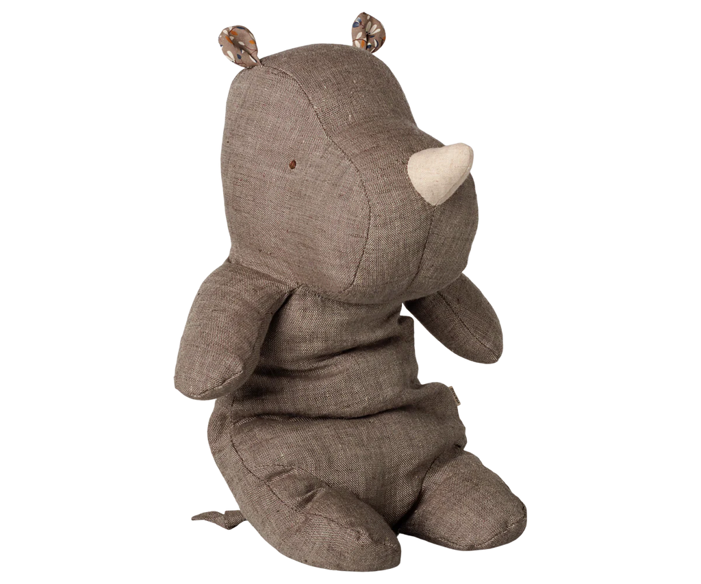 The PRE-ORDER Maileg Safari Friends Rhino, Medium - Grey Blend sits upright with a white horn, stitched details, patterned inner ears, no visible mouth, and a soft finish. Background is plain white. Estimated arrival mid November.