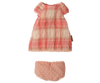 PRE-ORDER: Maileg Dress, Teddy Junior - Coral. This small coral dress for cotton dolls features short sleeves and checks, perfectly paired with pink polka-dotted bloomers. Displayed on a plain white background. Estimated arrival: Early November.