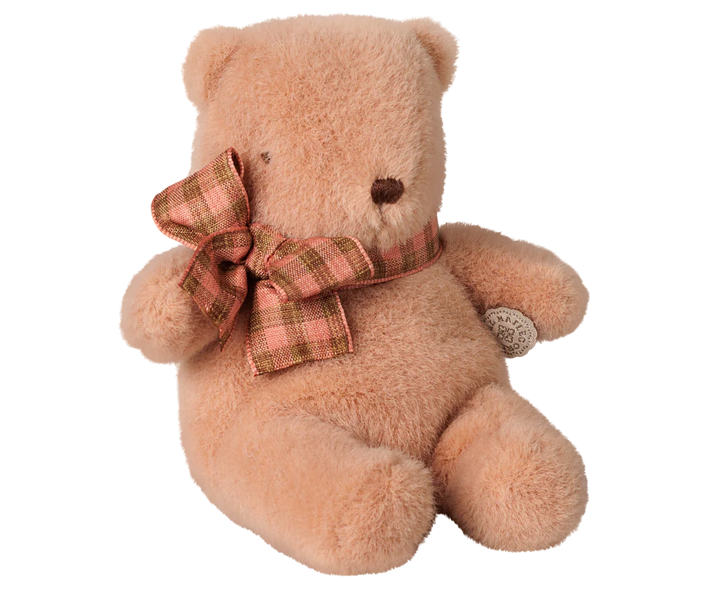 The PRE-ORDER: Maileg Teddy Bear Plush, Mini - Vintage Rose (est. arrival early October) is a soft, huggable teddy bear with a pink and brown plaid ribbon, small eyes, stitched nose, and a circular tag on its right arm.