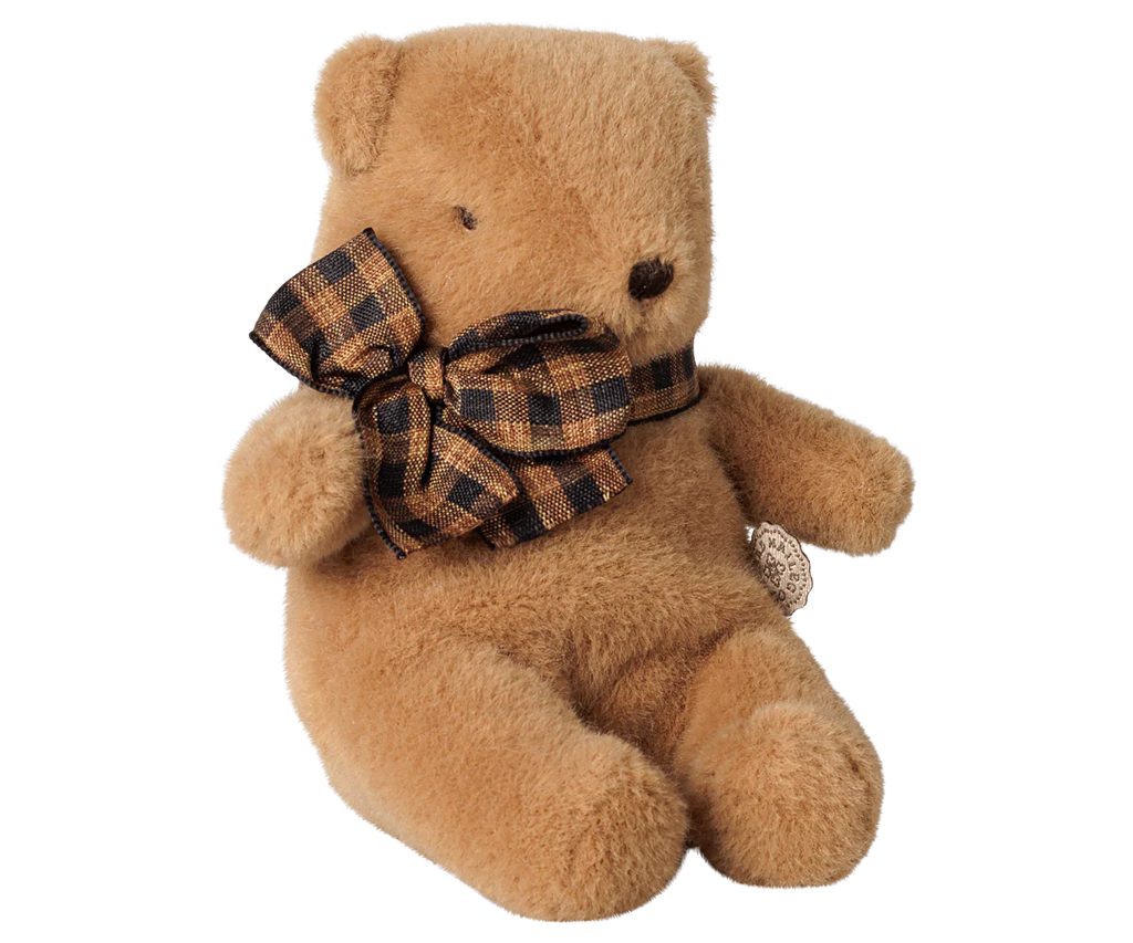 The PRE-ORDER: Maileg Teddy Bear Plush, Mini - Mushroom is a soft light brown bear sitting upright with a checkered bow and a small dark nose, shown on a plain white background. Estimated arrival: Early October.