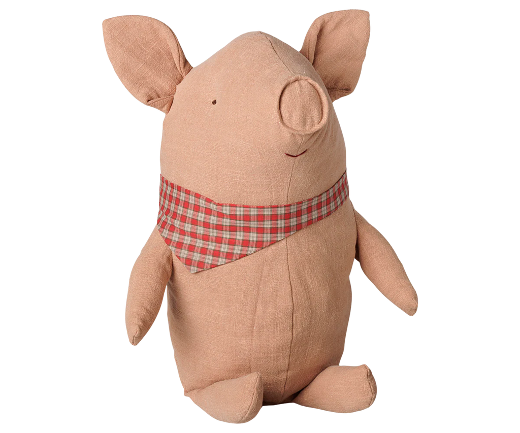 The PRE-ORDER: Maileg Truffle Pig, Big - Powder (Estimated Arrival Mid November) is a soft, plush pig toy with a stitched smile and a red and beige checked scarf, sitting upright on a white background.