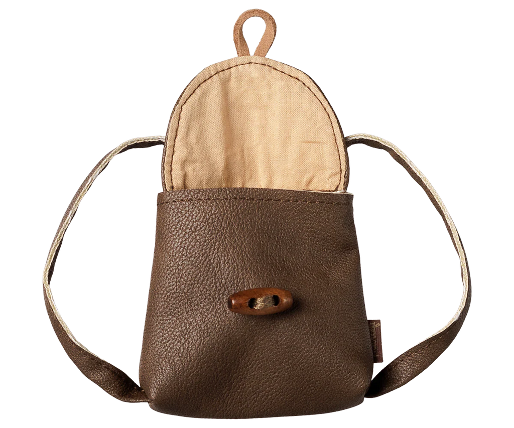 The PRE-ORDER: Maileg Backpack, Medium Mouse (Estimated Arrival Early November) is a small brown leather pouch with a beige fabric lining, open flap, wooden toggle closure, and two short straps for a charming vintage look.