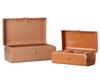 The PRE-ORDER Maileg Storage Suitcase Set in powder and coral features two rectangular metal cases with hinged lids, divided compartments, minimalist design, and small front locks. Includes tray. Estimated arrival early November.