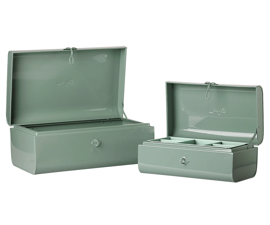 The PRE-ORDER: Maileg Storage Suitcase Set - Dark Mint with Tray (Estimated Arrival Early November) features two light green metal suitcases with front latches, hinged lids, and includes one empty large case and a small case with three compartments.
