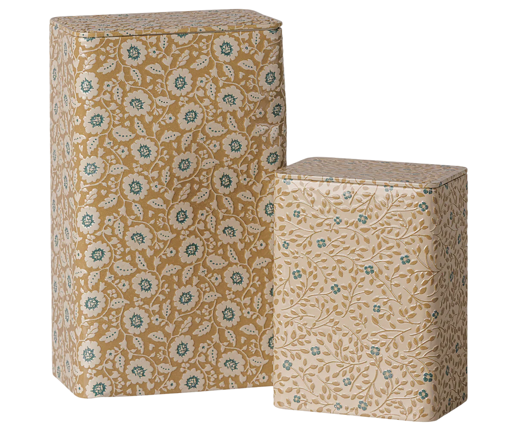The PRE-ORDER: Maileg Metal Box Set - Flowers - Ocher/Blue (Estimated Arrival Early October) includes two rectangular tins with matching floral prints, one tall and one short, both with fitted lids and rounded edges.