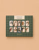 A green patterned box labeled "Memory Game - Animal Kingdom" displays vintage illustrations of zebra, giraffe, lion, cheetah, owl, raccoon, dog, fox, and kangaroo set against a peach background.