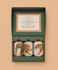 The Memory Game - Animal Kingdom is a boxed set featuring three stacks of vintage animal illustrations—elephant, monkey, and leopard—in an open green box with instructions inside the lid for this fun matching game.