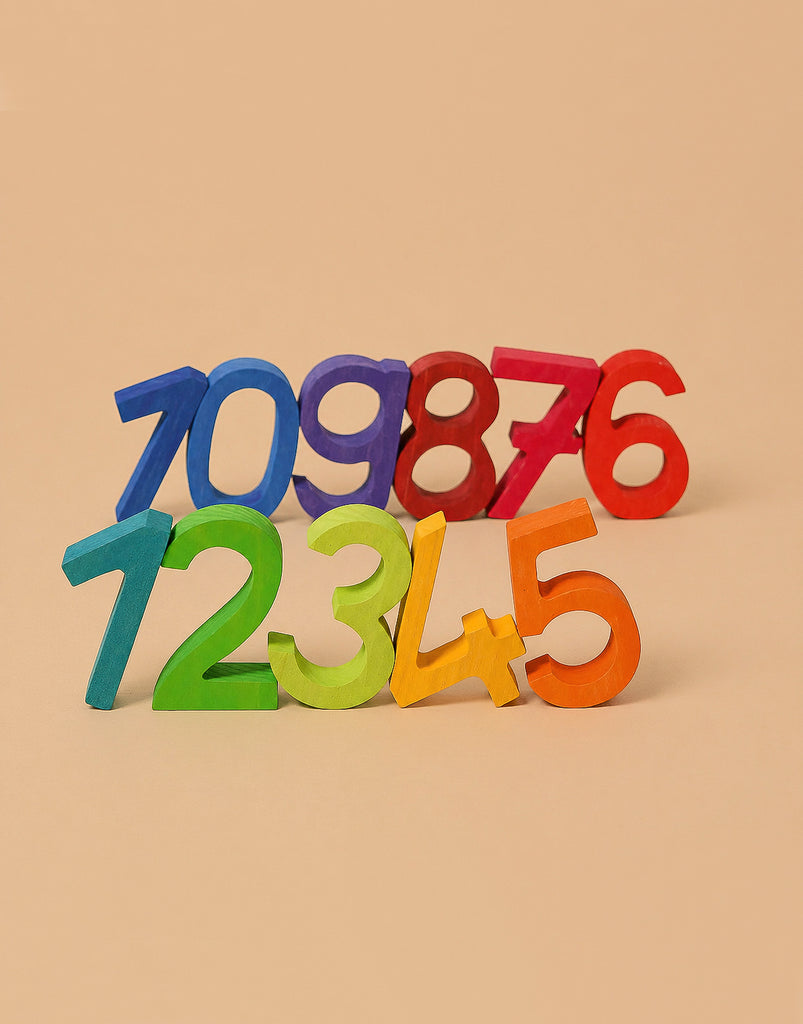 Grimm's Building Set - Numbers features rainbow numbers 1-9 in vibrant colors, upright in two staggered rows on beige. Perfect for building and stacking, it makes learning fun and helps develop motor skills.