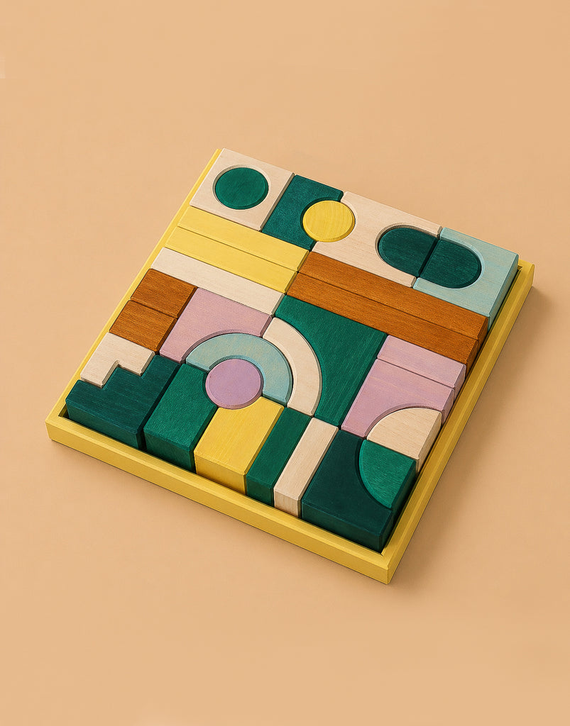 Grimm's Small Building Block Set - Movement: Colorful geometric wooden blocks in green, yellow, white, pink, and brown arranged in a yellow tray—perfect for creative building with circles, rectangles, and arches.
