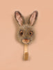 The Coat Hanger - Brown Hare features a realistic, plush brown hare head with upright ears on a wooden base, perfect for adding animal charm to your wall.