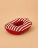 A plush, red and white striped donut-shaped cushion, featuring a small label and set against a beige background—perfect as an accessory for your Maileg Rubber Boat, Small Mouse - Red Stripe, or as a cozy resting place for playful mice.