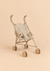 Konges Sloejd Doll Stroller - Tiny Hearts, featuring heart-patterned fabric and coordinated double wheels, displayed against a plain beige background.