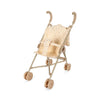 A beige, collapsible Konges Sloejd Doll Stroller - Multi Star with a polka dot fabric seat and backrest. The stroller has four pairs of brown double wheels and rounded beige handles, designed for children to play with.