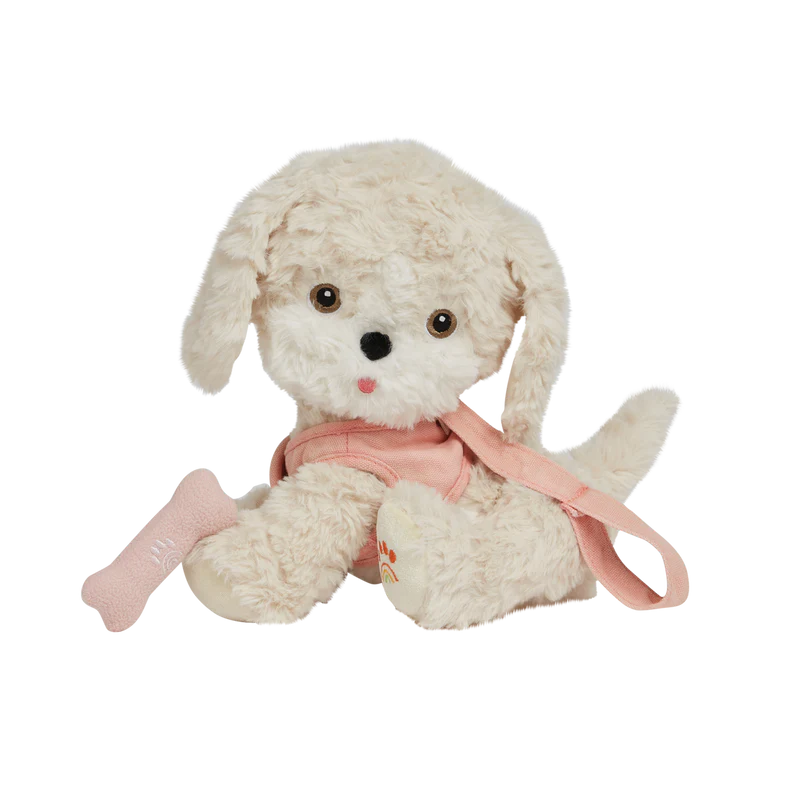 A plush fabric toy dog from Olli Ella Dinkum Dogs with fluffy white fur, large expressive eyes, and a pink bow, sitting against a plain background with a slight digital glitch effect on one side.
